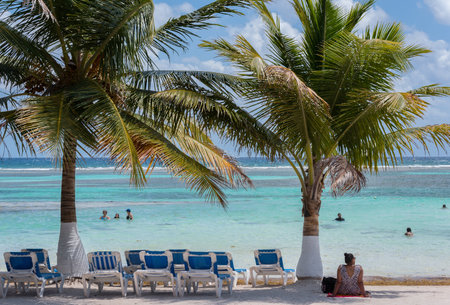 Tourists on the Mahahual Sandy Beach, Quintana Roo, Mexicoのeditorial素材