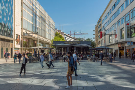 Unknown people walk down the Zeil shopping street, Frankfurt, Germanyのeditorial素材
