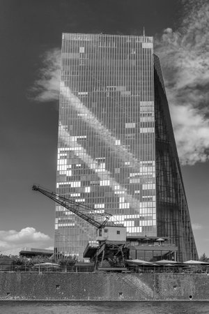 Old harbor crane in the front of the building of the European Central Bank, Frankfurt, Germanyのeditorial素材