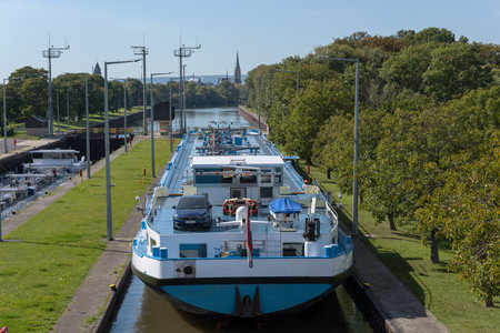 Cargo ship in the Frankfurt-Griesheim lock, Hesse, Germanyのeditorial素材