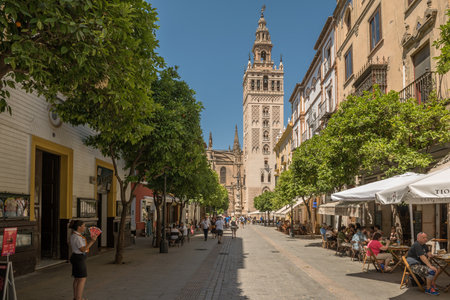 Unidentified people walking down a street in the old town, Andalusia, Sevilleのeditorial素材