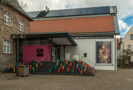 Colorful garden gnomes stand on a staircase in front of the Stadtmuseum Hofheim am Taunusのeditorial素材