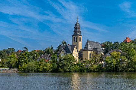 The Main river bank and Sacred Heart Church, Kelsterbach am Main, Hesse, Germanyの写真素材