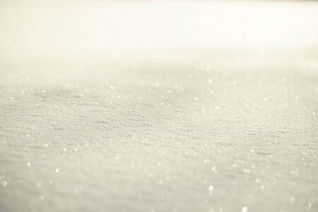 White shiny glowing snow background, snow texture on sun