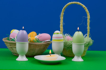 Easter eggs with beautiful motive and candle.の写真素材