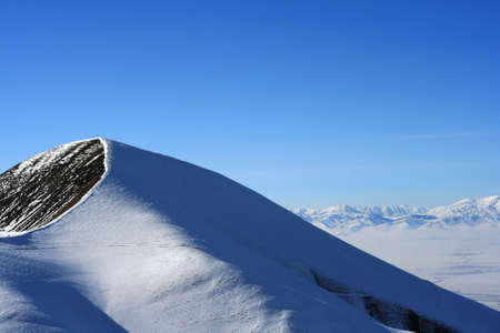 A photo of a snow mountain peakの写真素材