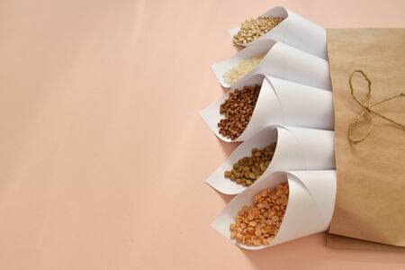 Different cereals in individual packaging with a copy of the space.