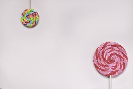 Above and below, round multi-colored sweets of different sizesの写真素材