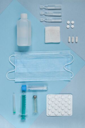 Medicines on color cardboard in a rowの写真素材