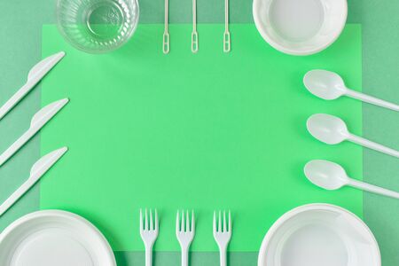 Ecology. Disposable plastic dishes. Caring for the environment. Recycling problem. Minimalism. Flatlay. Top view. Flat lay.の写真素材