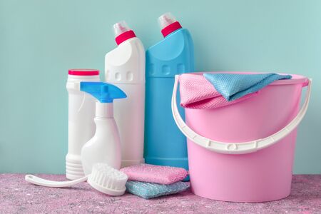 Various bottles of washing sponges, rags and gloves with brushes. Everything for cleaning in one place. Inventory for the maid. Virus protection. Disinfection of a house, office, apartment.の写真素材
