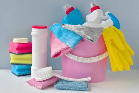 Various bottles of washing sponges, rags and gloves with brushes. Everything for cleaning in one place. Inventory for the maid. Virus protection. Disinfection of a house, office, apartment.の写真素材