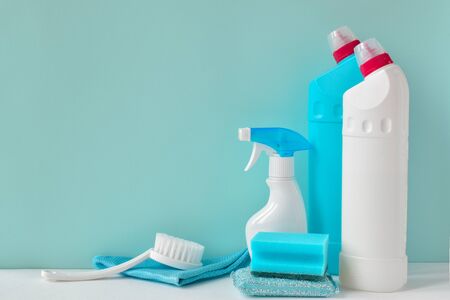 White bottles of household chemicals on a blue background with copy space.の写真素材