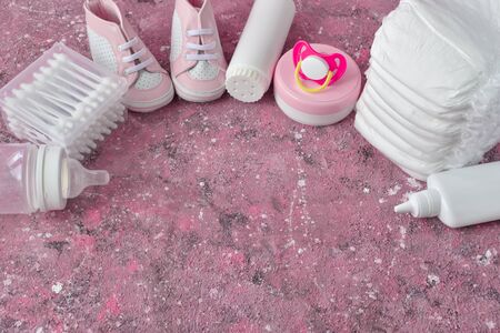 Baby supplies on a pink background. This is an empty place. Top View Flatlay Layoutの写真素材