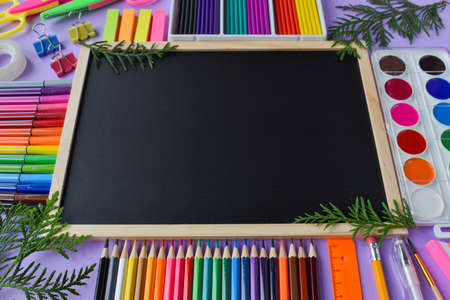 Office supplies and a blackboard with place for text. Back to school.の写真素材