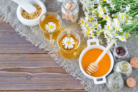 Herbal tea with honey in the upper right corner view from the topの写真素材