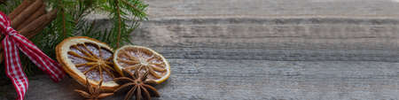 Banner of ingredients for mulled wine on a wooden background. Christmas card. Happy New Year. Space for text.の写真素材