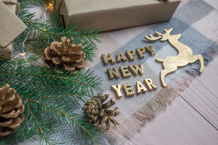Golden letters and deer. New Year's background. flat lay