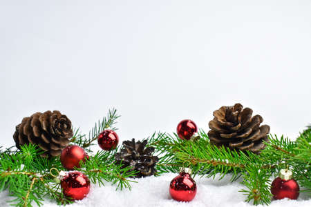 Festive decor of branches, cones and red balls