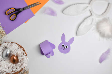 DIY paper rabbit for Easter. Step-by-step instructions. Top view. Step 3 Glue it together.の写真素材