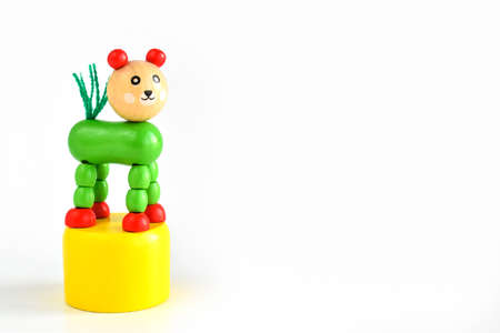 Bright wooden toys for children on a white background. Toys made of natural wood, isolated on a white background. Eco-friendly and organic products for children.の写真素材