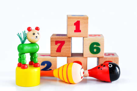 Bright wooden toys for children on a white background. Toys made of natural wood, isolated on a white background. Eco-friendly and organic products for children.の写真素材