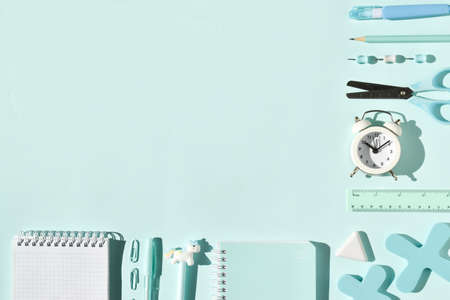 School stationery on a light blue background with space for text. Flat lay. Top view. Copy Space.