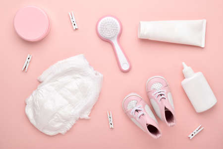 Accessories for the baby on a pink background. Child care. Flat lay, top view, copy space.の写真素材