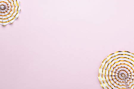 Festive pink background. Decoration of a birthday, or a party. Copy space. Flat layout, top view.の写真素材