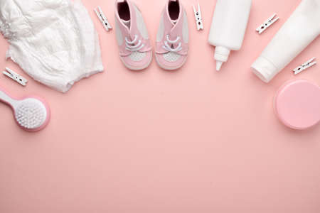 Accessories for the baby on a pink background. Child care. Flat layout, top view, a place to copy. Diapers-panties and baby's personal hygiene products.の写真素材