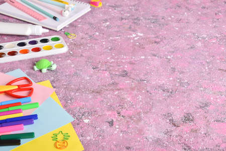 Stationery on a pink background with a space for text. Back to school. Flat lay.