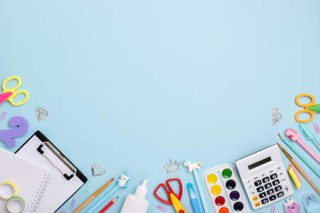 Flat lay office supplies. Various stationery on a light blue background. Back to school. copyspace