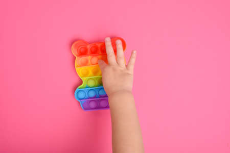Hand motor skills. A popular silicone toy for stress relief and motor development. copyspace