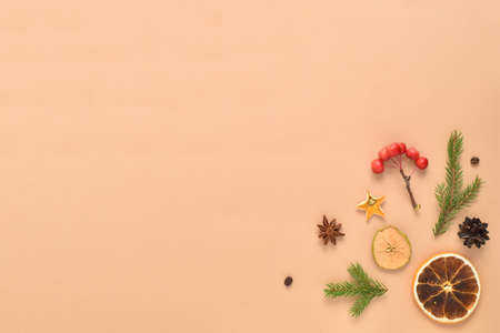 The Christmas composition of natural objects for decoration and decoration is laid out on a beige background. Flat layout, top view, a place to copy.の写真素材