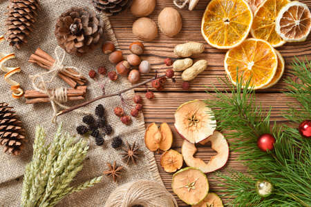 Dried flowers for children's creativity. Natural material for eco-design. Zero waste. Eco packaging for gifts for New Year and Christmas. Copy space. Flat lay, top view.の写真素材