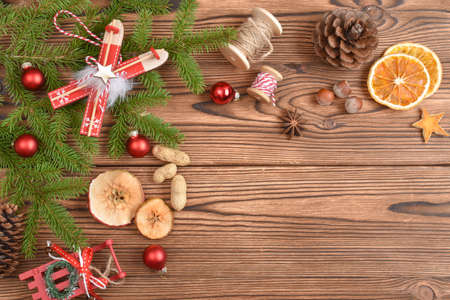 Christmas background made of fir branches, toys and eco-decorations. The natural design of the New Year's holiday. Greeting card for Christmas and New Year. Copy space. Flat lay, top view.の写真素材