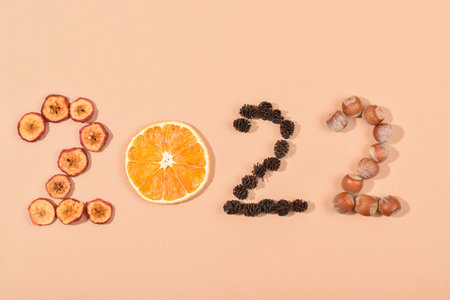 2022 is made from natural dried materials. The figures are made of environmentally friendly materials. Healthy food calendar. New year. Copy space. Flat lay, top view.の写真素材