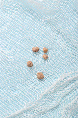 Gallstones cut out lie on gauze.の写真素材