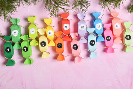 A Christmas calendar consisting of colored candies. Children's crafts for the new year. Gift wrapping, a surprise for the new year 2022.の写真素材