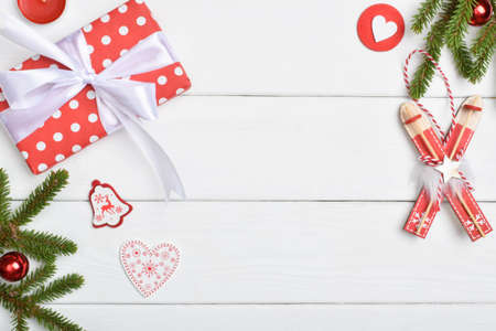 Christmas composition with gifts, glass balls and a fir branch. Space for copying. Flat position, top view. Christmas decoration in red and white.の写真素材