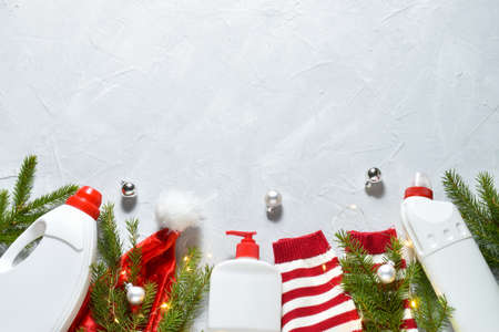 White plastic bottles from a Christmas tree on a gray background. Preparation for the holiday. Laundry room. Copy space. Flat lay, top view.の写真素材