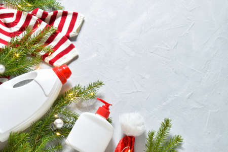 White plastic bottles from a Christmas tree on a gray background. Preparation for the holiday. Copy space. Flat lay, top view.の写真素材