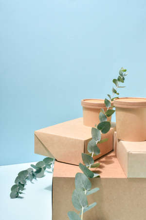 Vertical Eco-banner with paper packaging on a neutral blue background.の写真素材