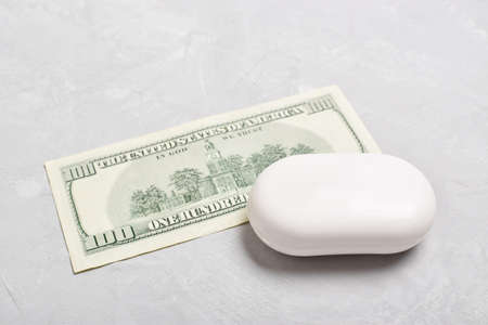 A bill under a bar of soap. Money laundering. Corruption and bribery. A bill under a bar of soap.