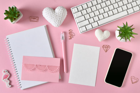 The layout of a kraft envelope with a place for text with a smartphone, knitted hearts, a keyboard and succulents. Bloggers and love, online communication. copyspace. Flat lay, top view.の写真素材
