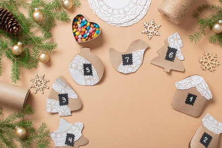 Christmas DIY with your own hands. Step-by-step instructions for making an advent calendar from kraft paper using openwork napkins. step 16の写真素材