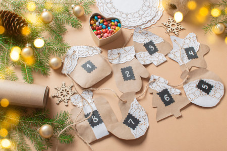 Christmas DIY with your own hands. Step-by-step instructions for making an advent calendar from kraft paper using openwork napkins. step 21の写真素材
