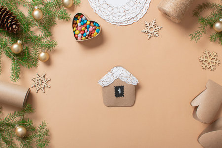 Christmas DIY with your own hands. Step-by-step instructions for making an advent calendar from kraft paper using openwork napkins. step 7の写真素材