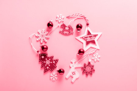 Christmas composition with Christmas tree eco-toys in the center. Color 2023, viva magenta.の写真素材