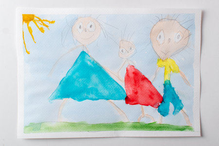 Childrens drawing of mom, dad, and child, in watercolor paints. A happy family.